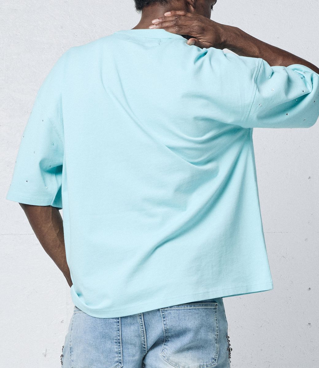 Fresh summer streetwear look with aqua blue T-shirt