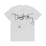 Casual streetwear look with minimal white graphic T-shirt
