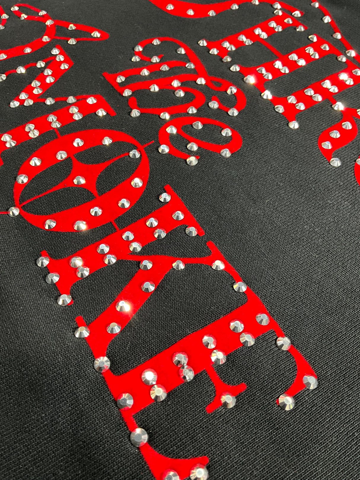close up of rhinestone detailing on Undrtd Through the Smoke 3/4 sleeve t-shirt premium finish