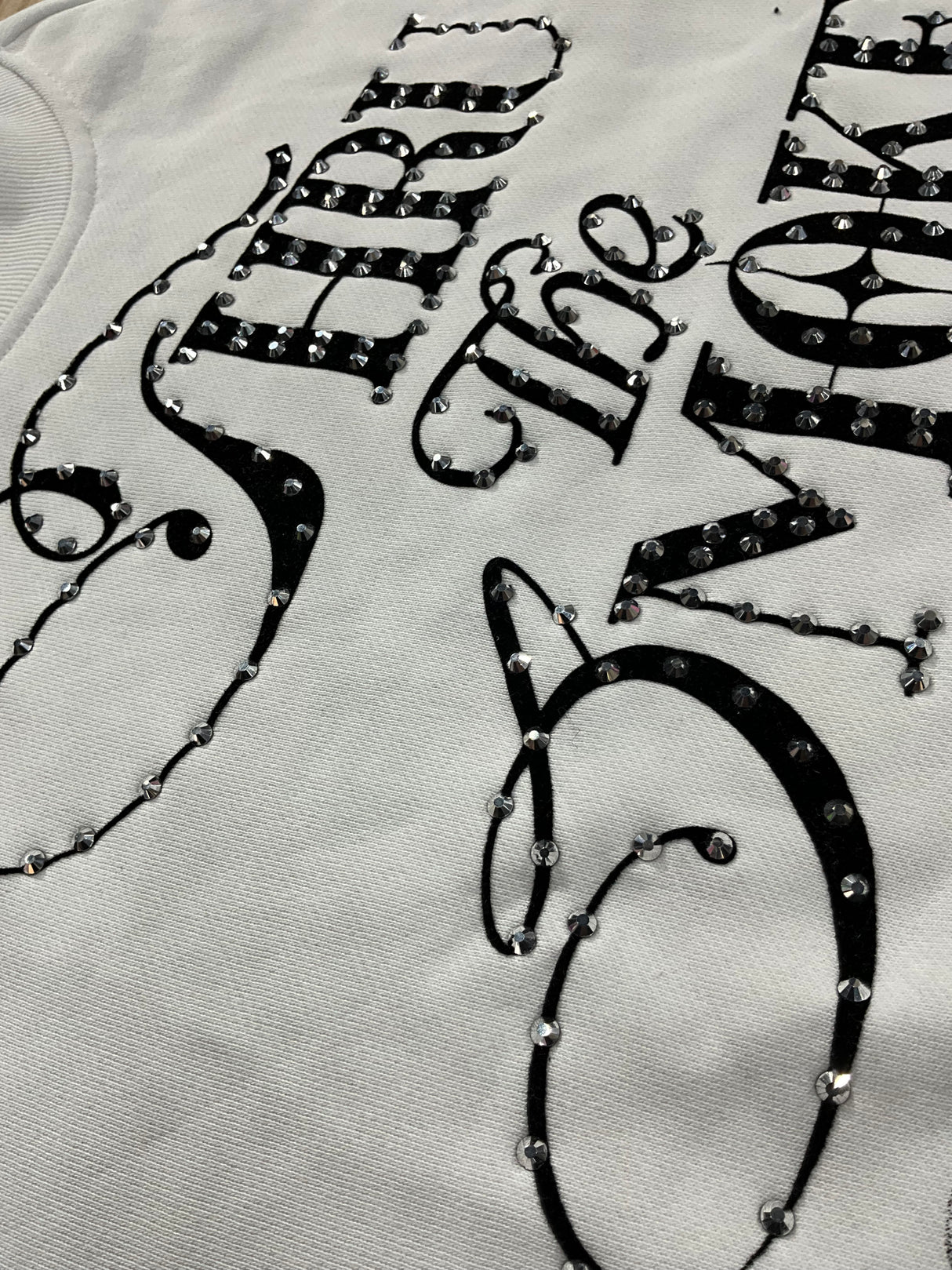 back view of Undrtd Through the Smoke rhinestone 3/4 sleeve t-shirt in multicolor